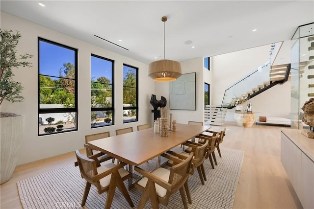 dining area with light wood-type flooring