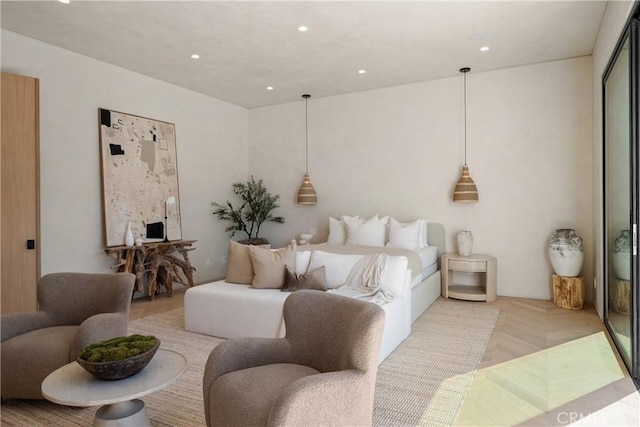 bedroom with light parquet flooring