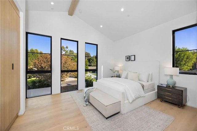 bedroom with light wood-type flooring, access to exterior, beam ceiling, and high vaulted ceiling