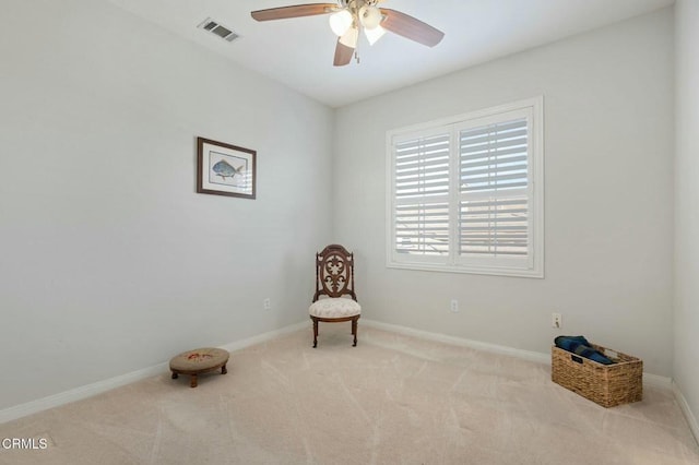 sitting room with light carpet and ceiling fan