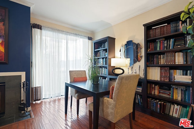 interior space with ornamental molding and wood-type flooring