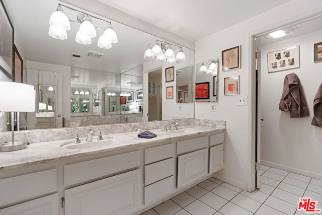 bathroom featuring tile patterned flooring and vanity