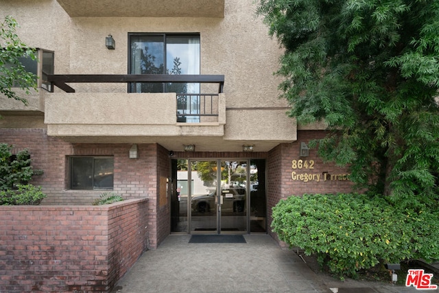 doorway to property with a balcony