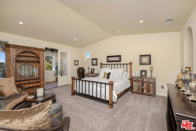 carpeted bedroom featuring vaulted ceiling