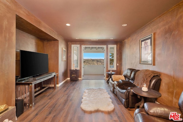 living room with dark hardwood / wood-style flooring