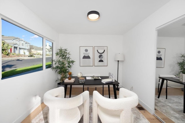 office space with light wood-type flooring