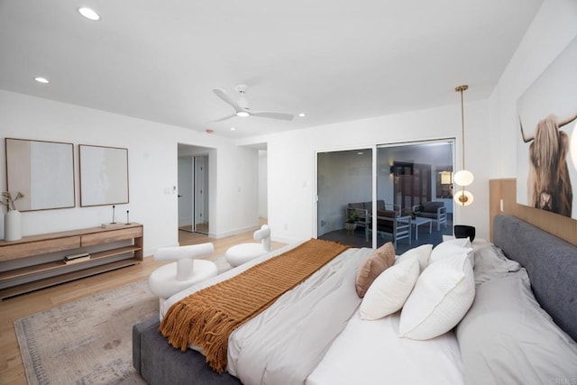 bedroom with a closet, ceiling fan, and light wood-type flooring