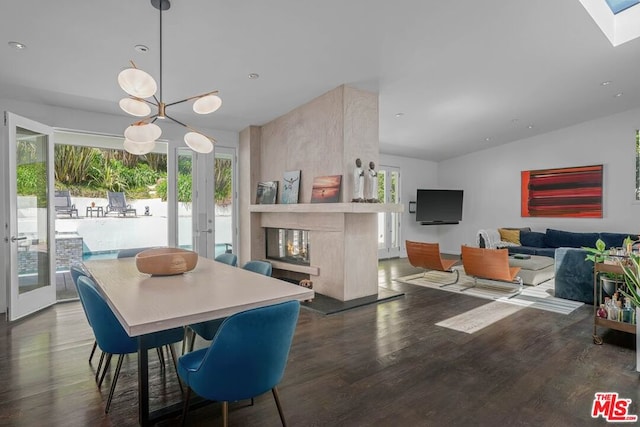 dining room featuring dark hardwood / wood-style flooring, lofted ceiling, and french doors