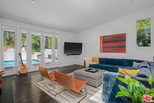 living room featuring lofted ceiling, french doors, and dark hardwood / wood-style floors