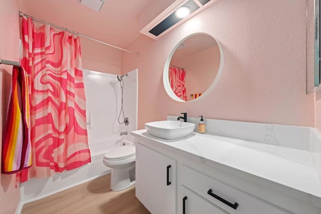 full bathroom with toilet, hardwood / wood-style floors, vanity, and shower / bathtub combination with curtain