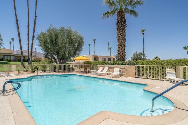 view of swimming pool with a patio area