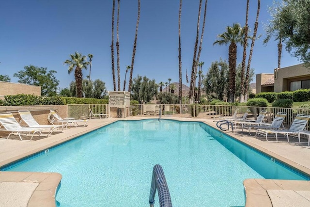 view of swimming pool with a patio area