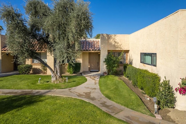 view of front of home with a front lawn