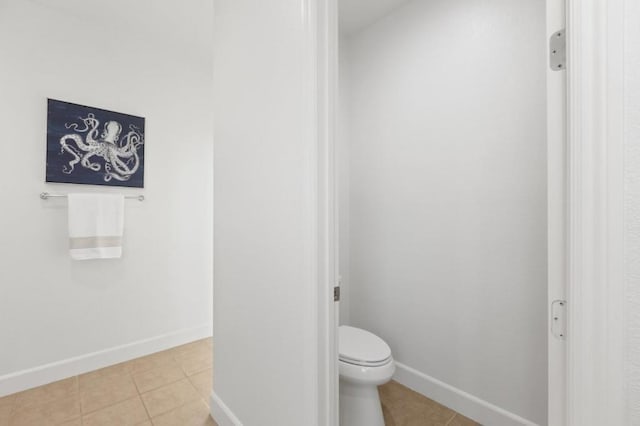 bathroom featuring toilet and tile patterned floors