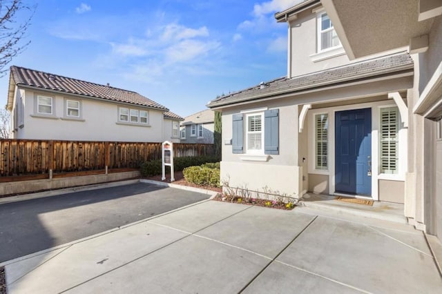 back of property with a patio