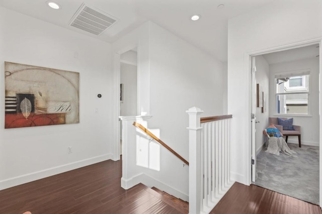 corridor with dark hardwood / wood-style floors