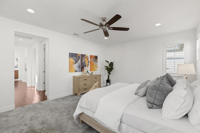 bedroom with ceiling fan and carpet flooring