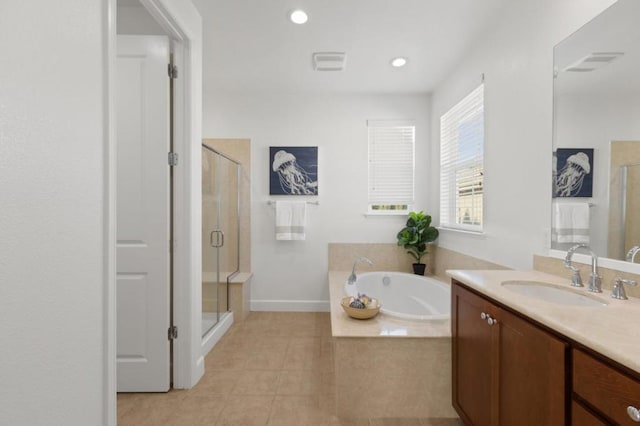 bathroom with independent shower and bath, tile patterned flooring, and vanity