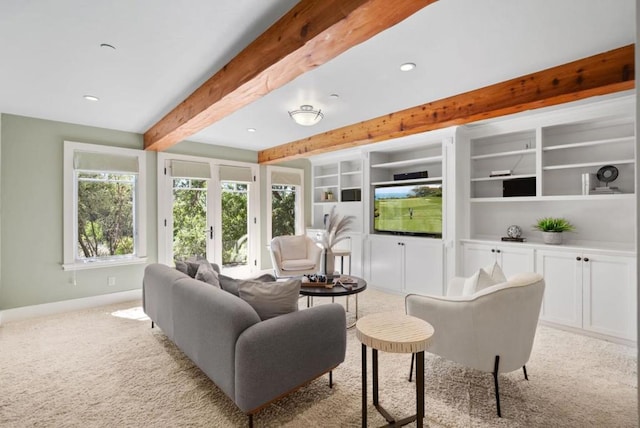 carpeted living room with beam ceiling and built in features