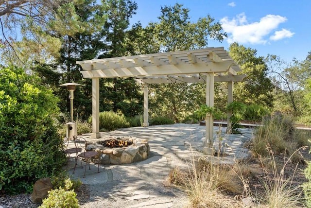 view of patio featuring a fire pit and a pergola