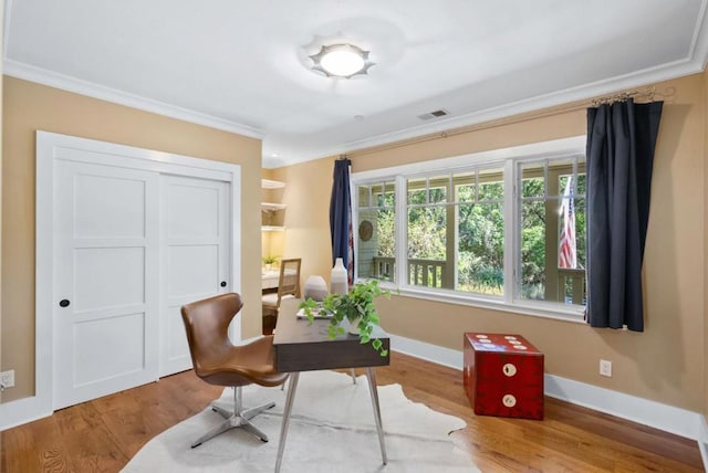 office space featuring ornamental molding and hardwood / wood-style flooring