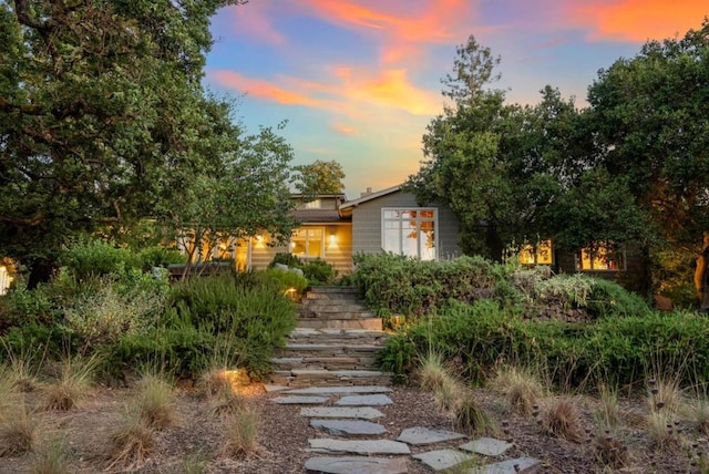 view of property hidden behind natural elements