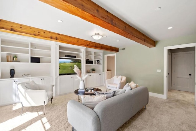 carpeted living room with built in shelves and beamed ceiling