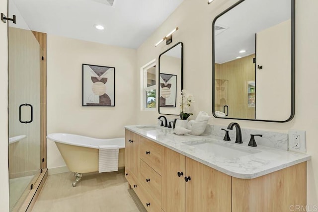 bathroom with vanity, tile patterned floors, and plus walk in shower