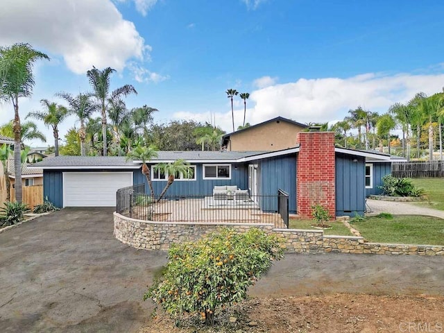 ranch-style home with a garage