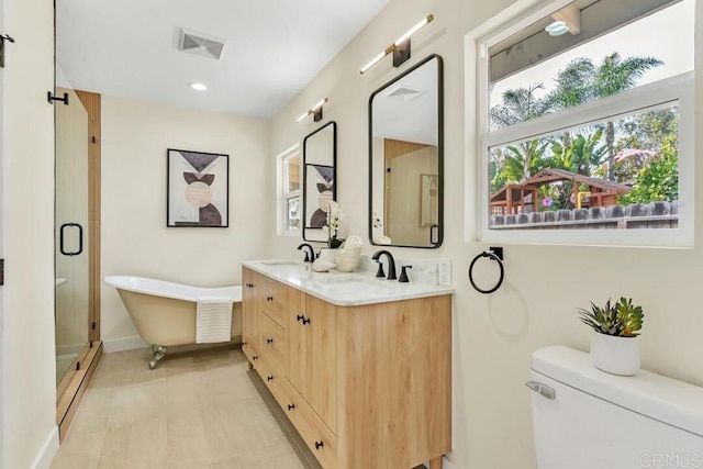 full bathroom featuring vanity, toilet, independent shower and bath, and a baseboard heating unit