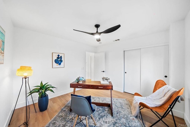 home office featuring ceiling fan and light wood-type flooring