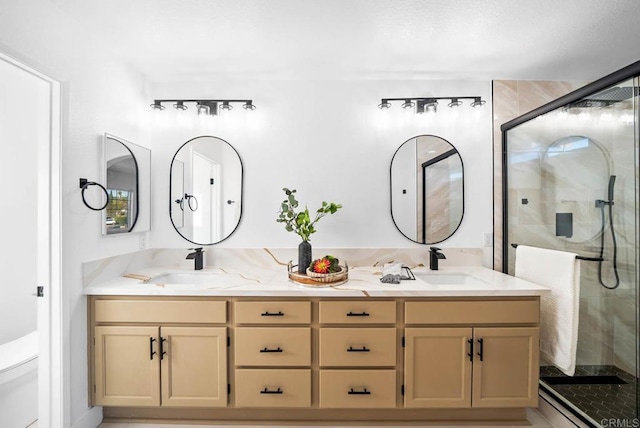 bathroom with an enclosed shower, vanity, and toilet