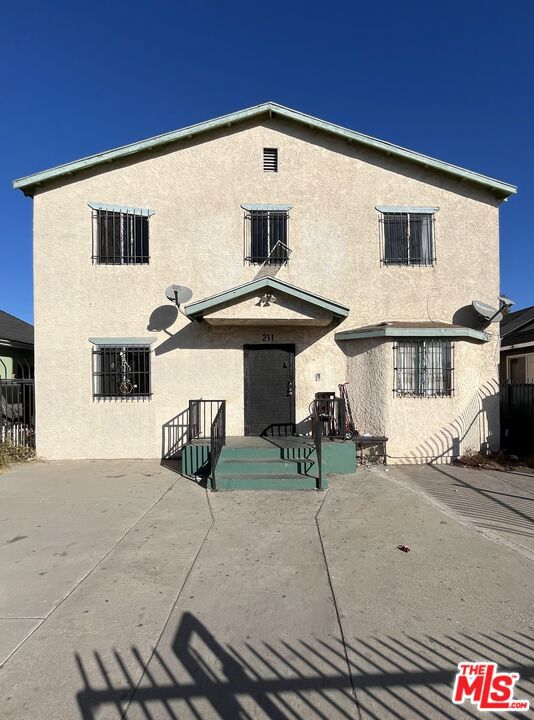 rear view of house with a patio