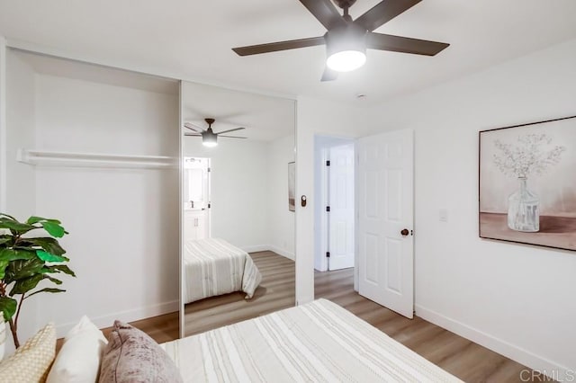 bedroom featuring ceiling fan and hardwood / wood-style flooring