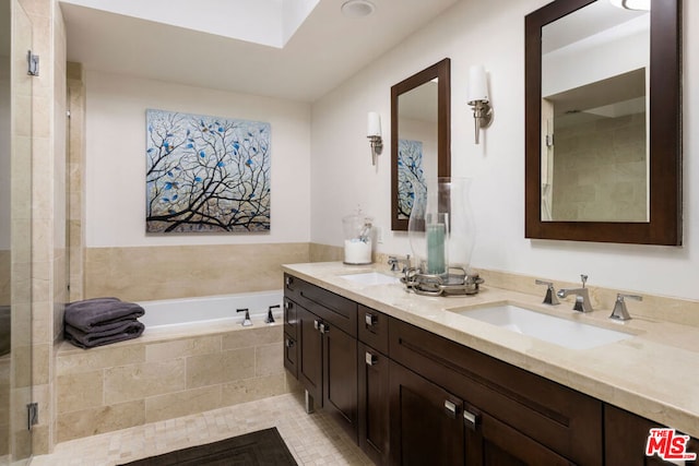 bathroom featuring vanity, tile patterned flooring, and independent shower and bath