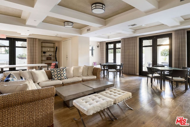 living room with coffered ceiling, hardwood / wood-style floors, french doors, and beamed ceiling