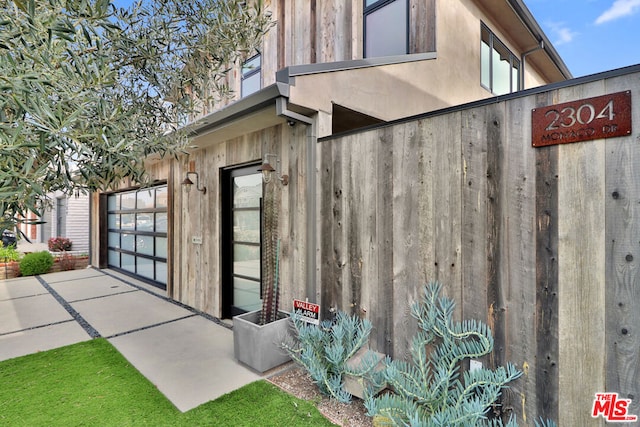 view of property exterior featuring a garage