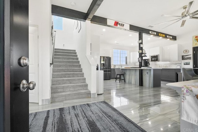 staircase with ceiling fan