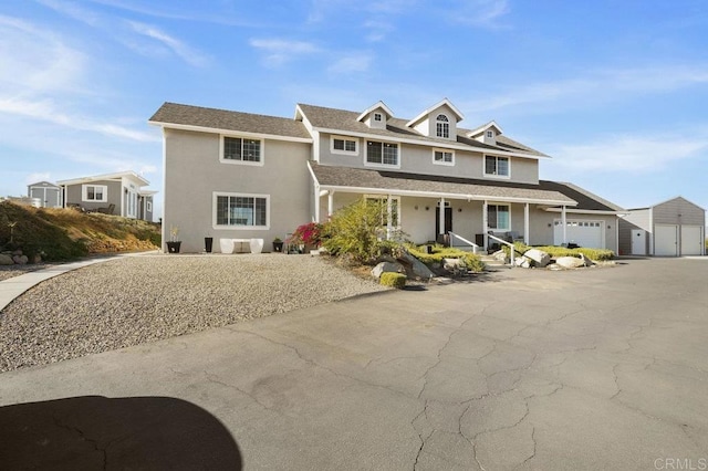 view of front of home with a garage and covered porch