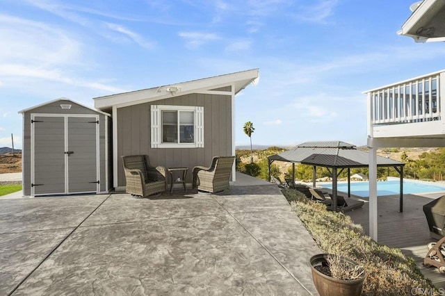 view of patio / terrace with a storage shed