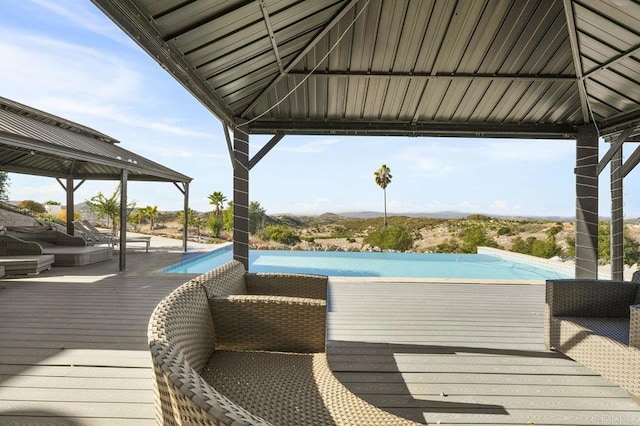 wooden deck featuring a gazebo