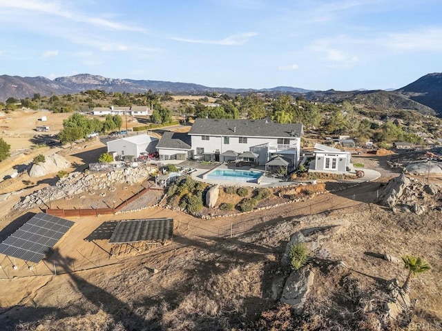 birds eye view of property with a mountain view