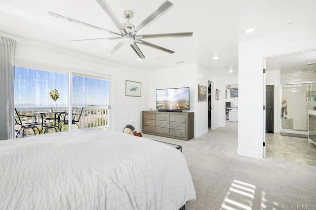 bedroom with ceiling fan, connected bathroom, light colored carpet, and access to outside