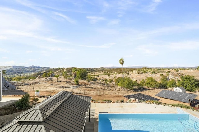 view of pool with a mountain view