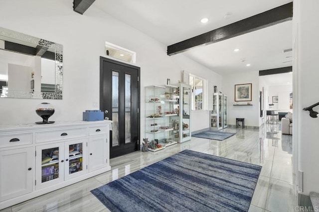 foyer entrance with french doors and beamed ceiling