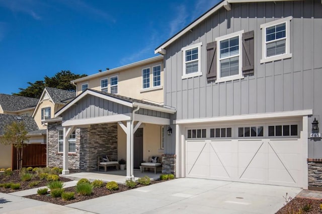 view of front of property featuring a garage and a porch