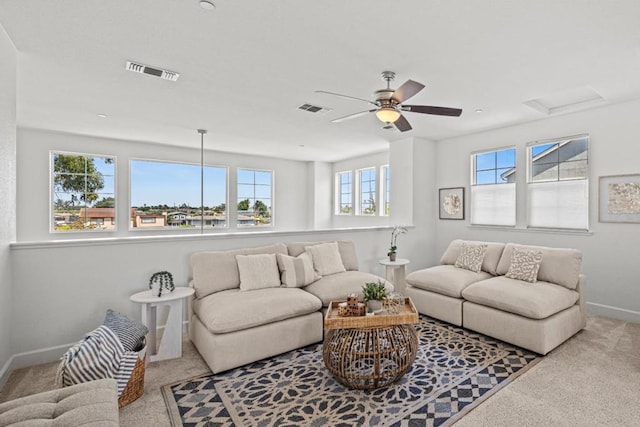 living room featuring light carpet and ceiling fan