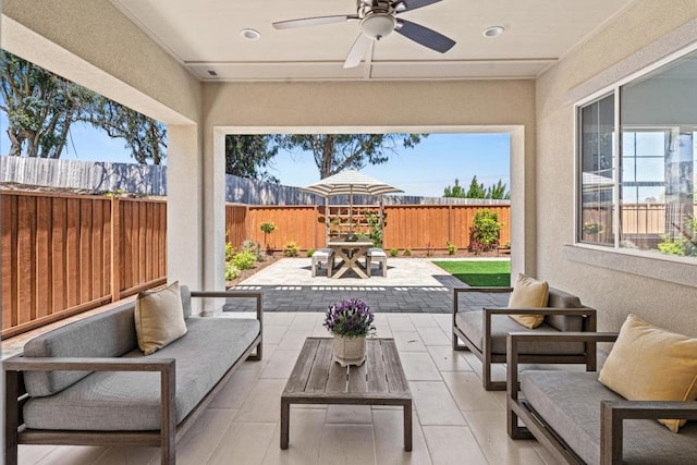 view of patio featuring ceiling fan and outdoor lounge area