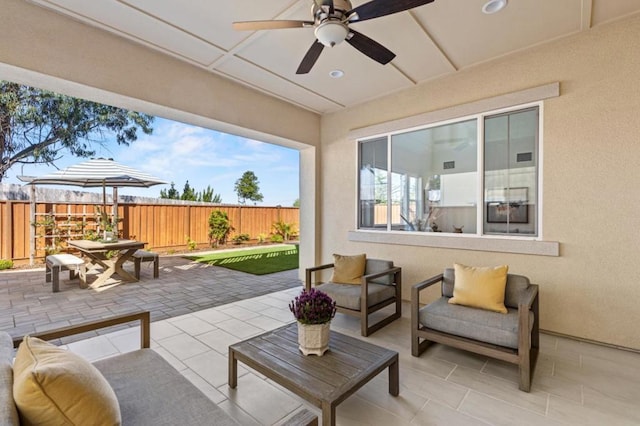 view of patio featuring ceiling fan