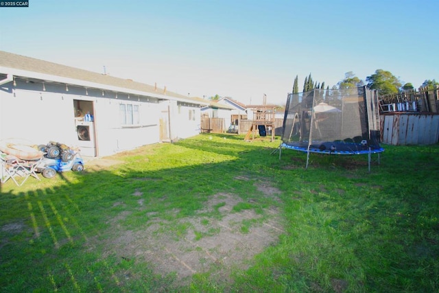 view of yard with a trampoline